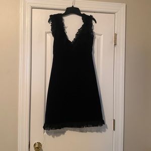 Black velvet dress size 4 with a shear ruffle